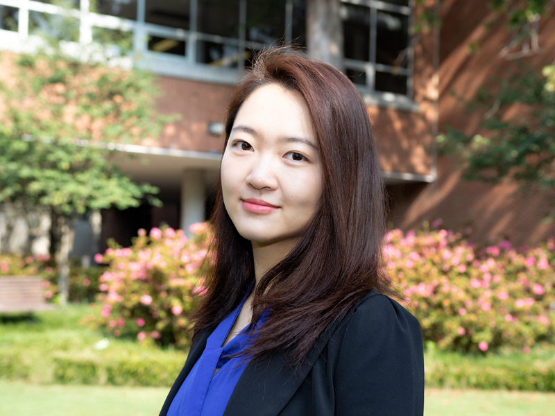 Headshot of Yiyi He, outdoors in the courtyard of the East Architecture building on Georgia Tech campus