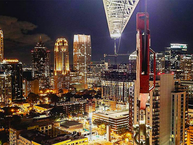 Atlanta skyline at night, with illuminated crane